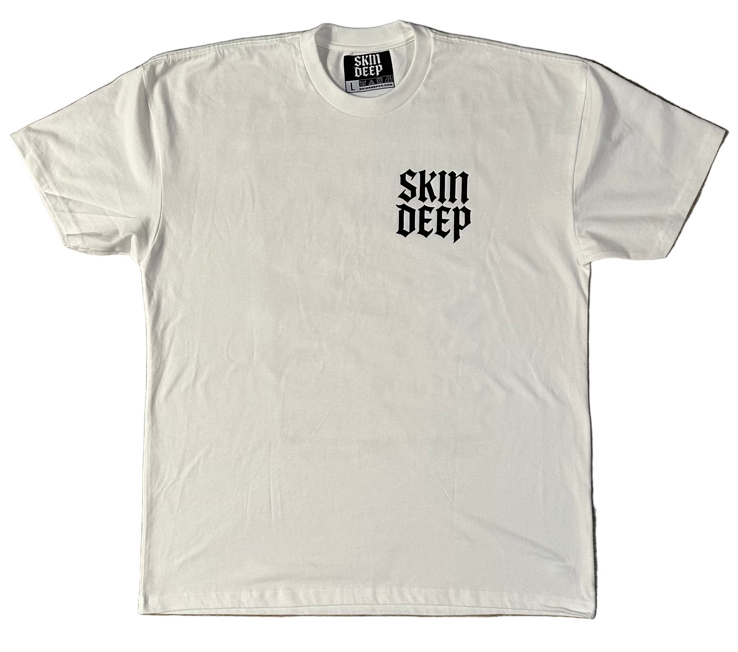 Skin Deep Vision Tee - white t-shirt featuring black tattoo-inspired artwork by tattoo artist Creamytaco13 from Croatia that reads "No one sees what you see even if they see it too" with images of eyes throughout the graphic on the back, the front features the name Skin Deep in the signature font in black