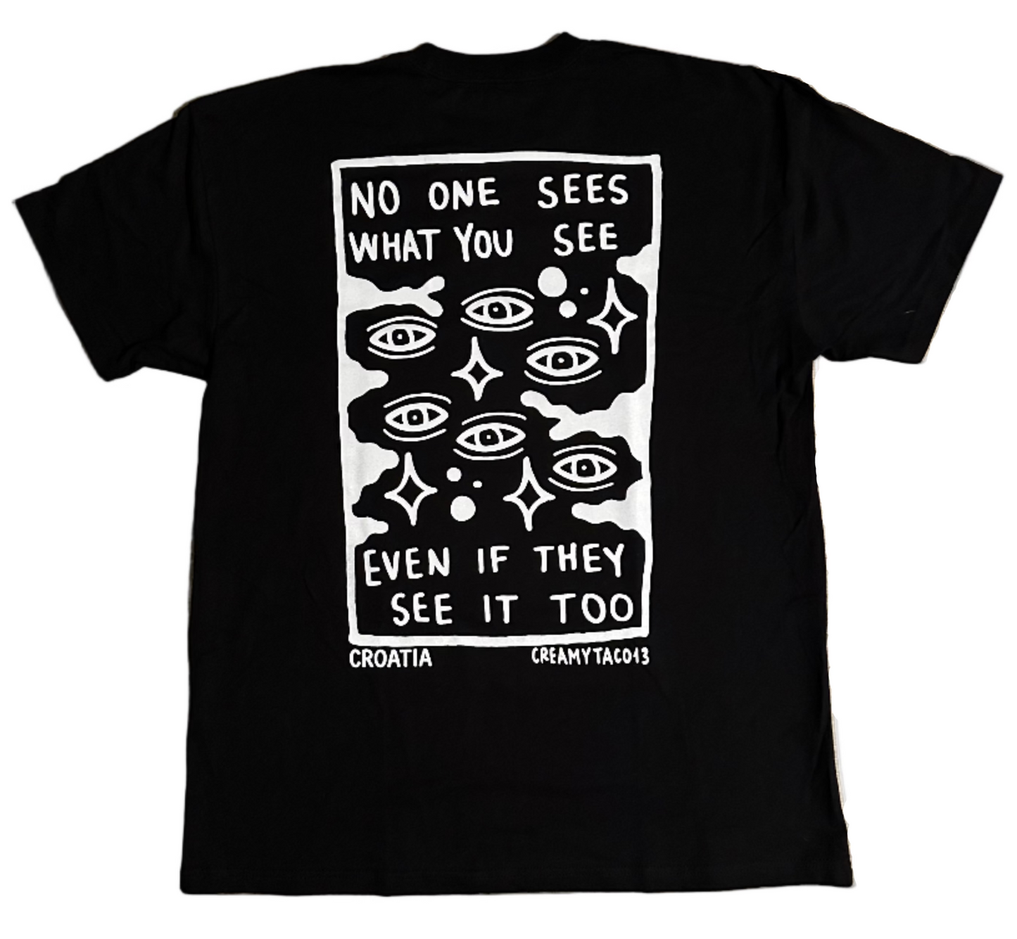 Skin Deep Vision Tee - black t-shirt featuring tattoo-inspired artwork by tattoo artist Creamytaco13 from Croatia that reads "No one sees what you see even if they see it too" with images of eyes throughout the graphic on the back, the front features the name Skin Deep in the signature font
