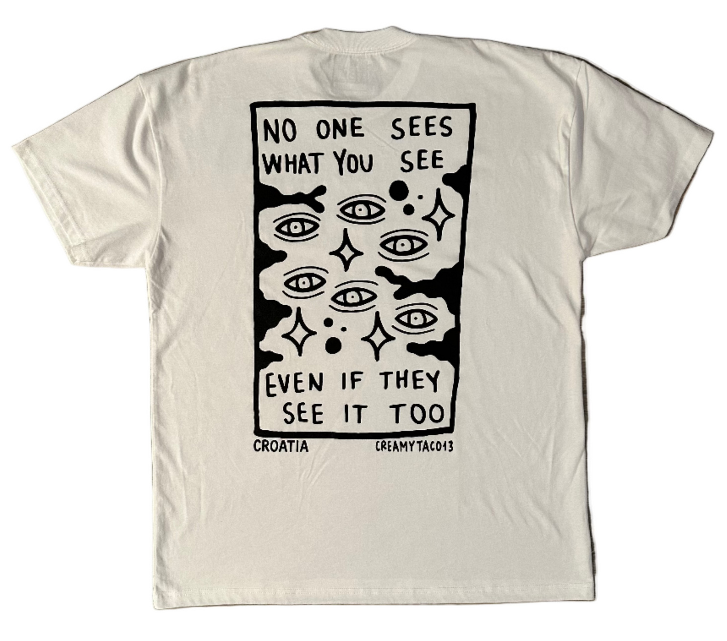 Skin Deep Vision Tee - white t-shirt featuring black tattoo-inspired artwork by tattoo artist Creamytaco13 from Croatia that reads "No one sees what you see even if they see it too" with images of eyes throughout the graphic on the back, the front features the name Skin Deep in the signature font in black