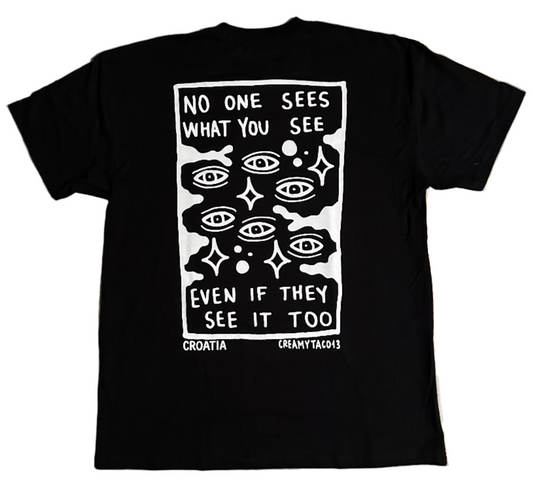 Skin Deep Vision Tee - black t-shirt featuring tattoo-inspired artwork by tattoo artist Creamytaco13 from Croatia that reads "No one sees what you see even if they see it too" with images of eyes throughout the graphic on the back, the front features the name Skin Deep in the signature font